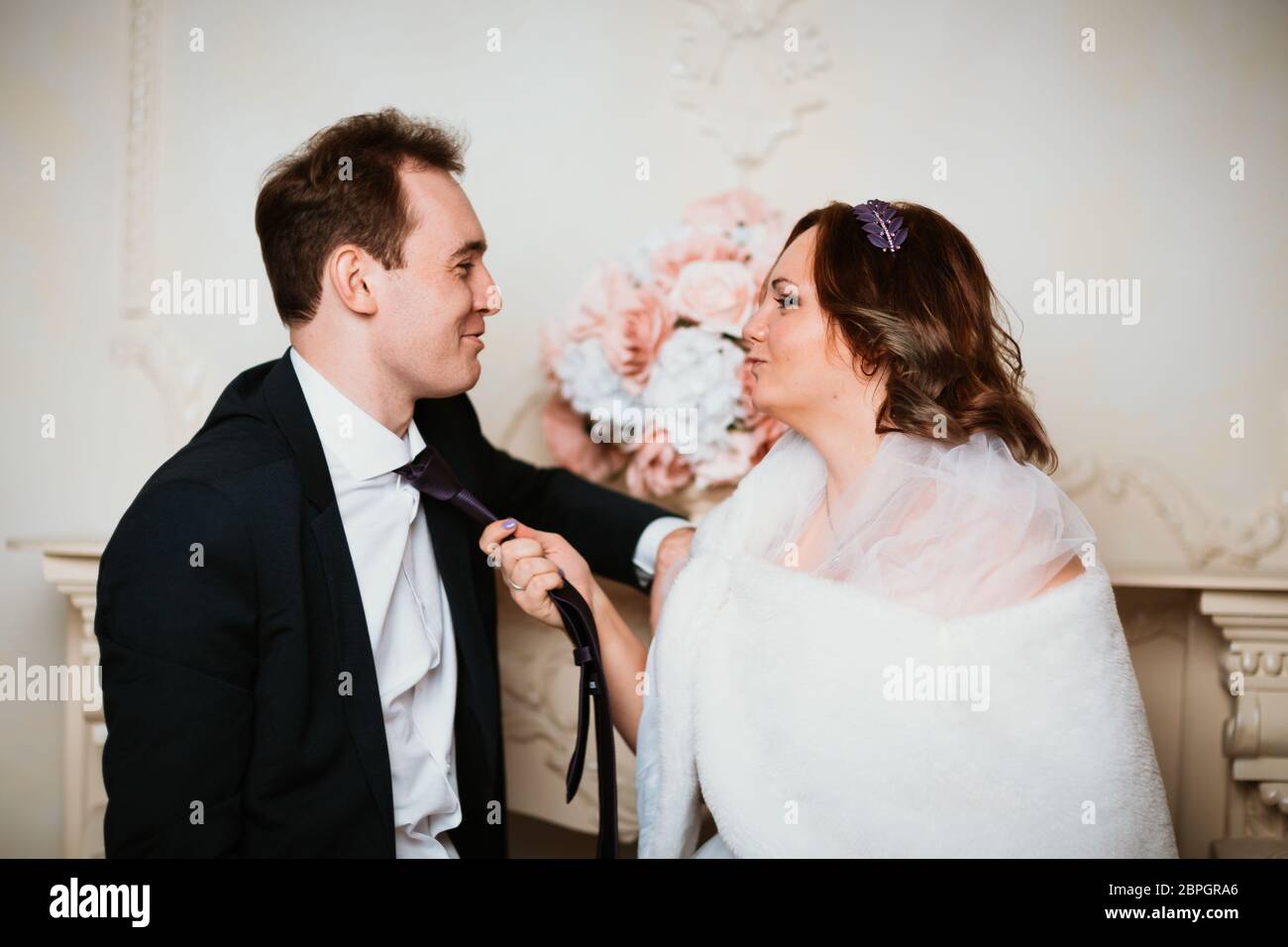 young bride and groom couple in a bright studio photo Stock Photo - Alamy