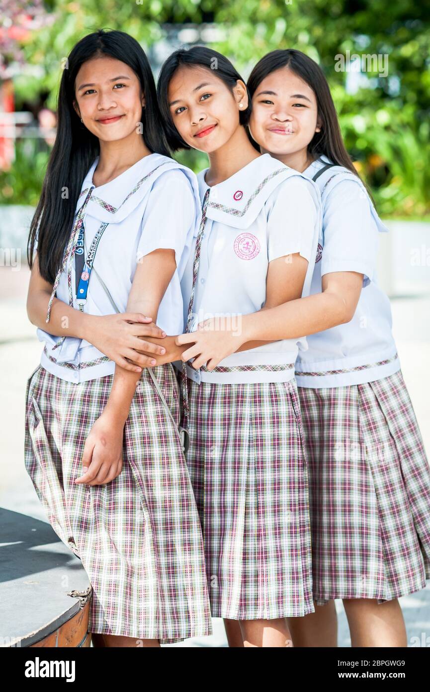 Playful Filipino school children pose in a park in Angeles City, The Philippines, South East Asia. Stock Photo