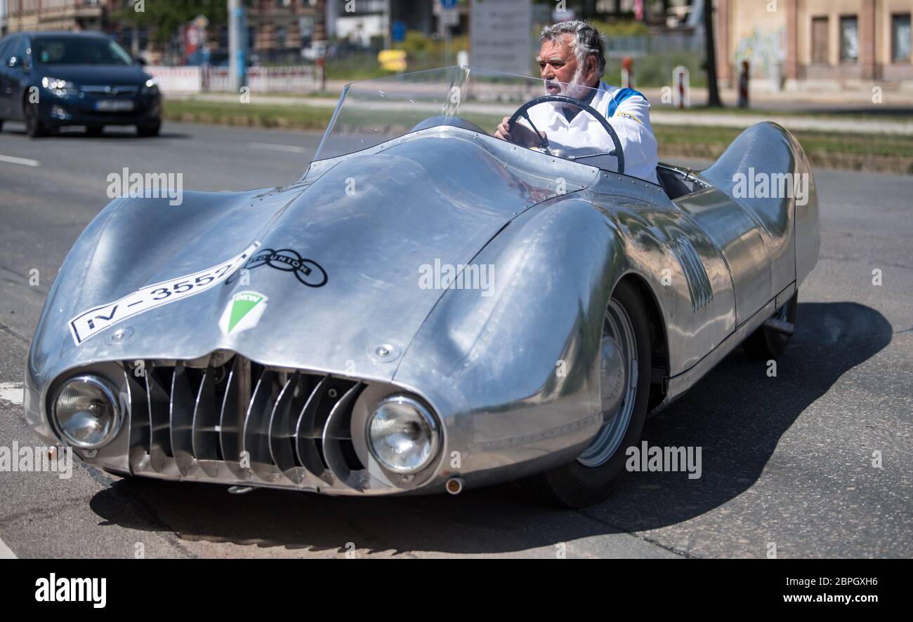 19 May 2020, Saxony, Chemnitz: Frieder Bach, collector and restorer of vintage cars, drives the last and brand new DKW F9 sports car in Chemnitz. Bach brought the vehicle to life based on a drawing from 1940, which he had discovered by chance during research for an exhibition in the Museum of Saxon Vehicles. It was the sketch for the last sports car that DKW, then under the umbrella of Auto Union, wanted to build. The vehicle was originally to take part in the Berlin - Rome race in 1938, but the war prevented it from being produced. More than 75 years later, the car was now built, with the hel Stock Photo