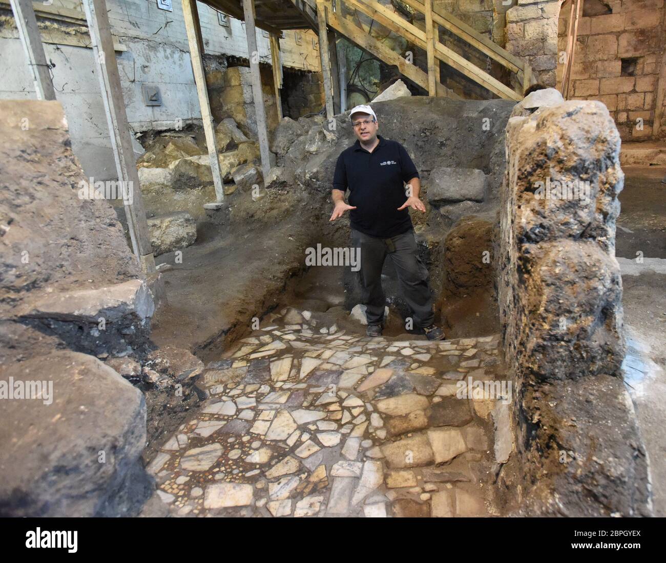 Jerusalem, Israel. 19th May, 2020. Israeli archaeologist Dr. Barak Monnickendam-Givon shows the marble and stone floor from the 10th Century that was unearthed by the Israel Antiquities Authority on Tuesday, May 19, 2020, in the Old City of Jerusalem. Archeologists have discovered an unique subterranean system in the bedrock of the Second Temple Period beneath a 1400 year-old public building in the underground excavations under the Western Wall. Photo by Debbie Hill/UPI Credit: UPI/Alamy Live News Stock Photo
