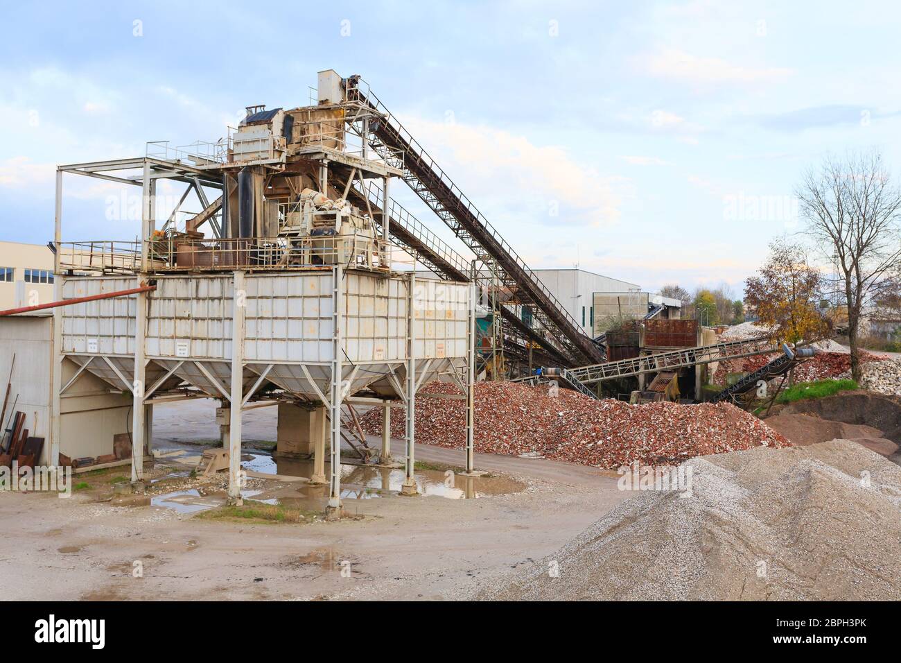Stone quarry with silos and conveyor belts. Industrial equipment