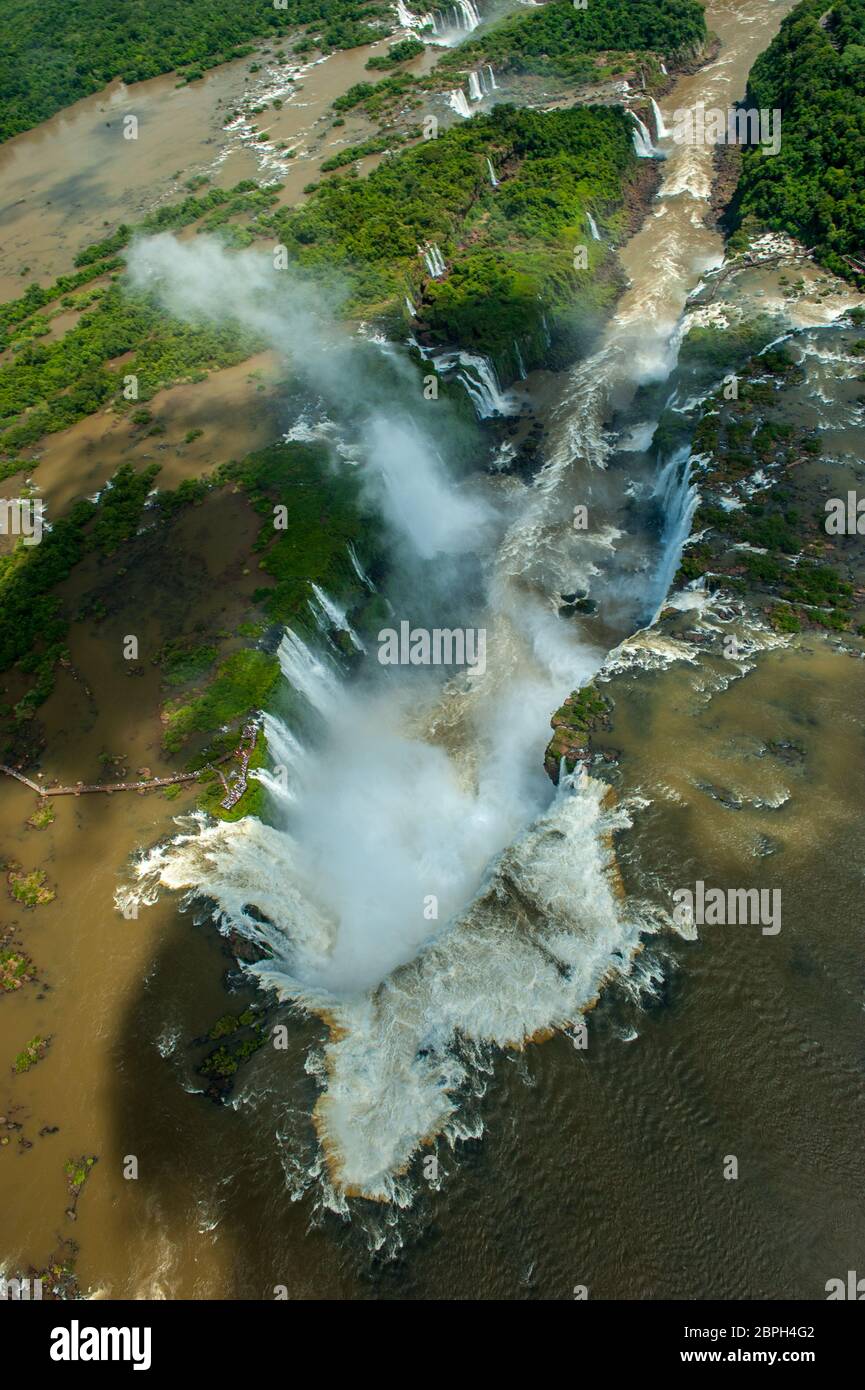 Breathtaking sights of Iguazu waterfalls fom helicopter and footpaths in argentina and brazil on a sunny day Stock Photo