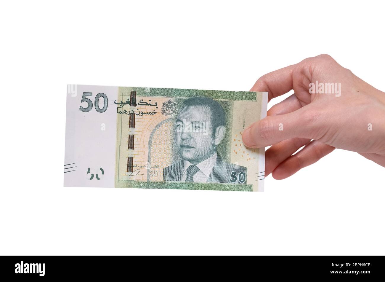 Female Hand Holding A 50 Moroccon Dirham Banknote Isolated On A White