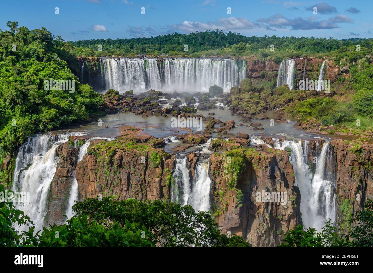 Breathtaking sights of Iguazu waterfalls fom helicopter and footpaths in argentina and brazil on a sunny day Stock Photo