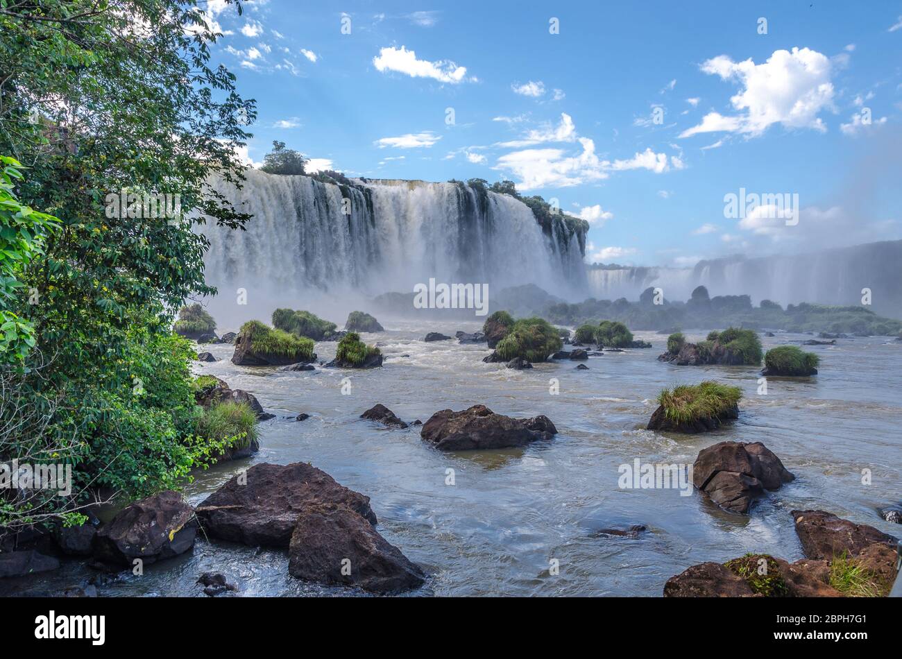 Breathtaking sights of Iguazu waterfalls fom helicopter and footpaths in argentina and brazil on a sunny day Stock Photo