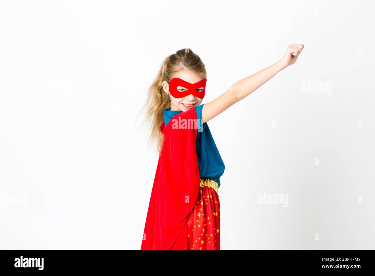 girl with red mask and supergirl outfit posing Stock Photo Alamy