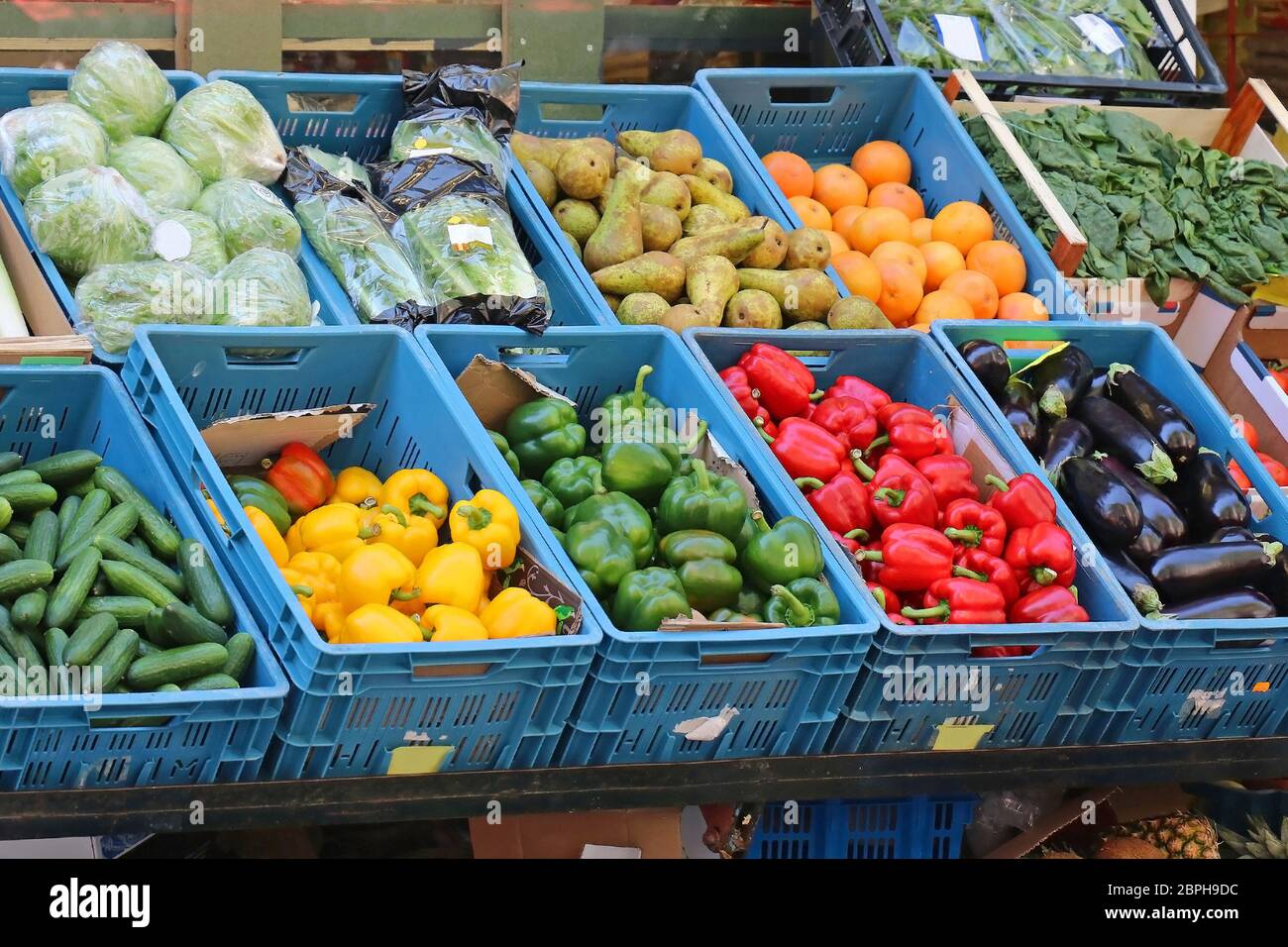 Fresh organic vegetables and fruits in plastic crates sold on market stall  Stock Photo - Alamy