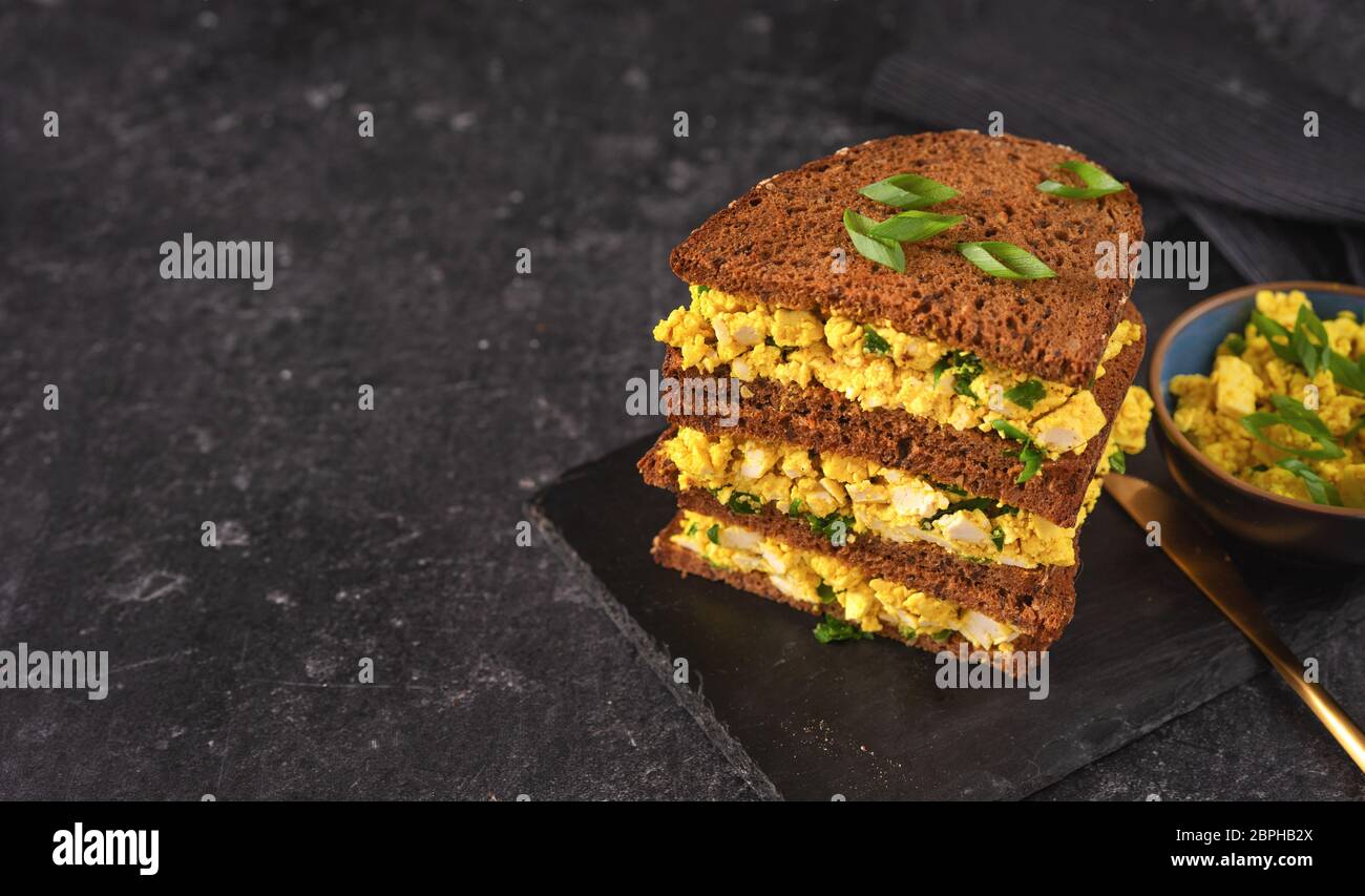 Bright vegan burger sandwich with vegan egg salad Stock Photo