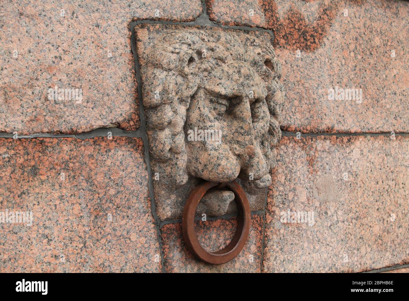 granite bas-relief of a lion's head on the quay Stock Photo - Alamy