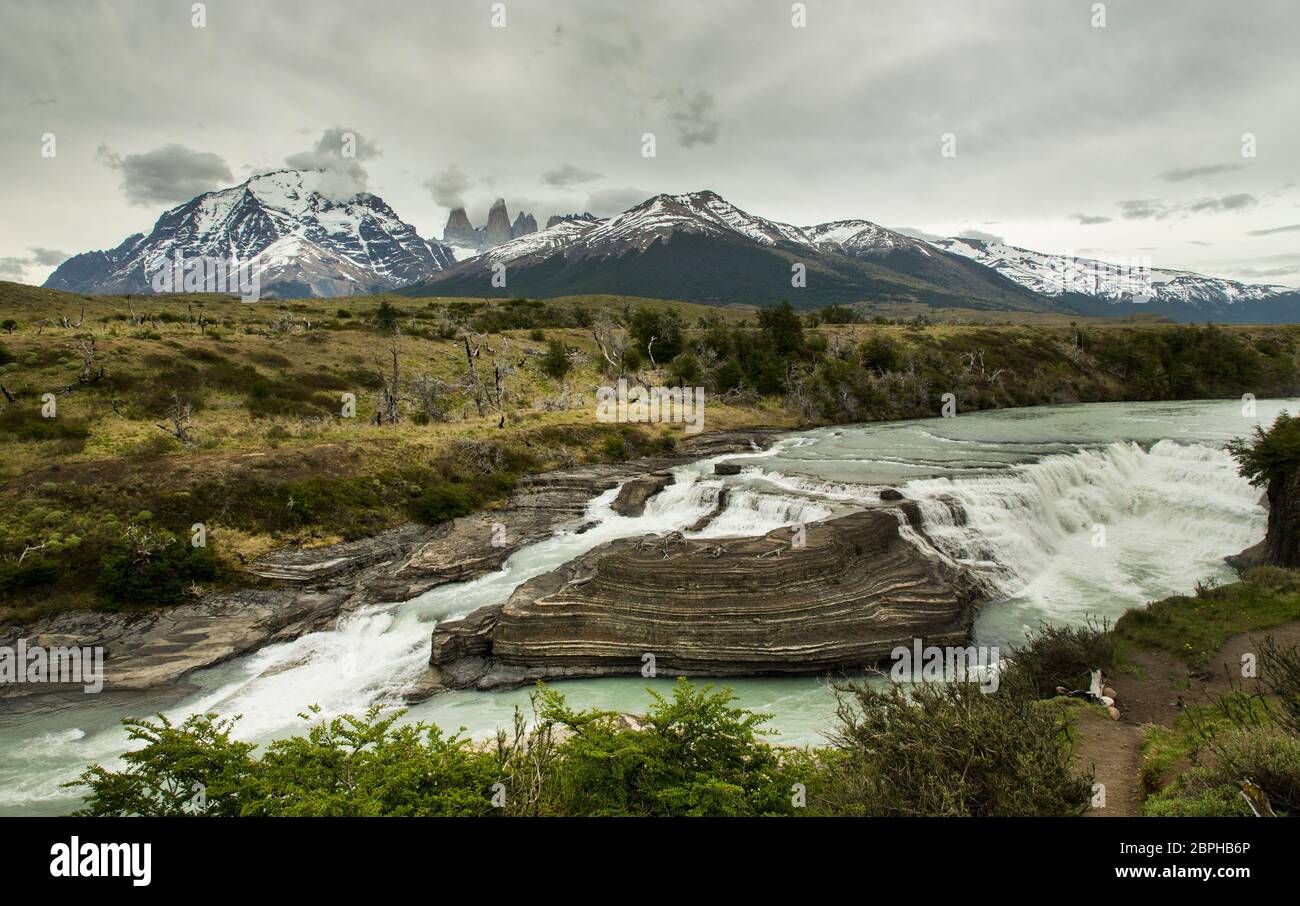 Stunning panorama of the Salto Grande waterfall with a backdrop of the Torres del Paine, Torres del Paine National Park, Patagonia, Chile Stock Photo