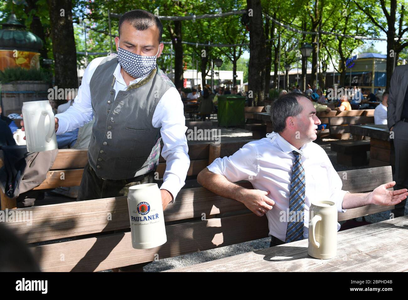 A Waiter With A Face Mask Mask Brings Beer Mugs Beer To The Table By Hubert Aiwanger Freie Waehler Minister Of Economics Bavaria Right Reopening Paulaner Biergarten Am Nockherberg In The Course