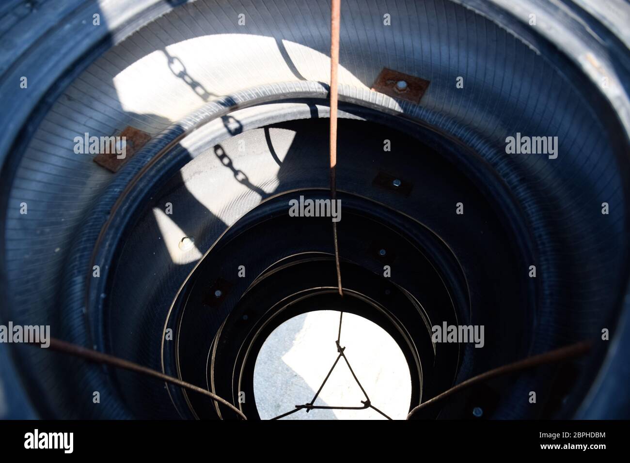 Homemade punching bag made from old car tires fastened with steel