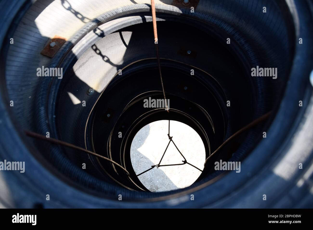 Homemade punching bag made from old car tires fastened with steel
