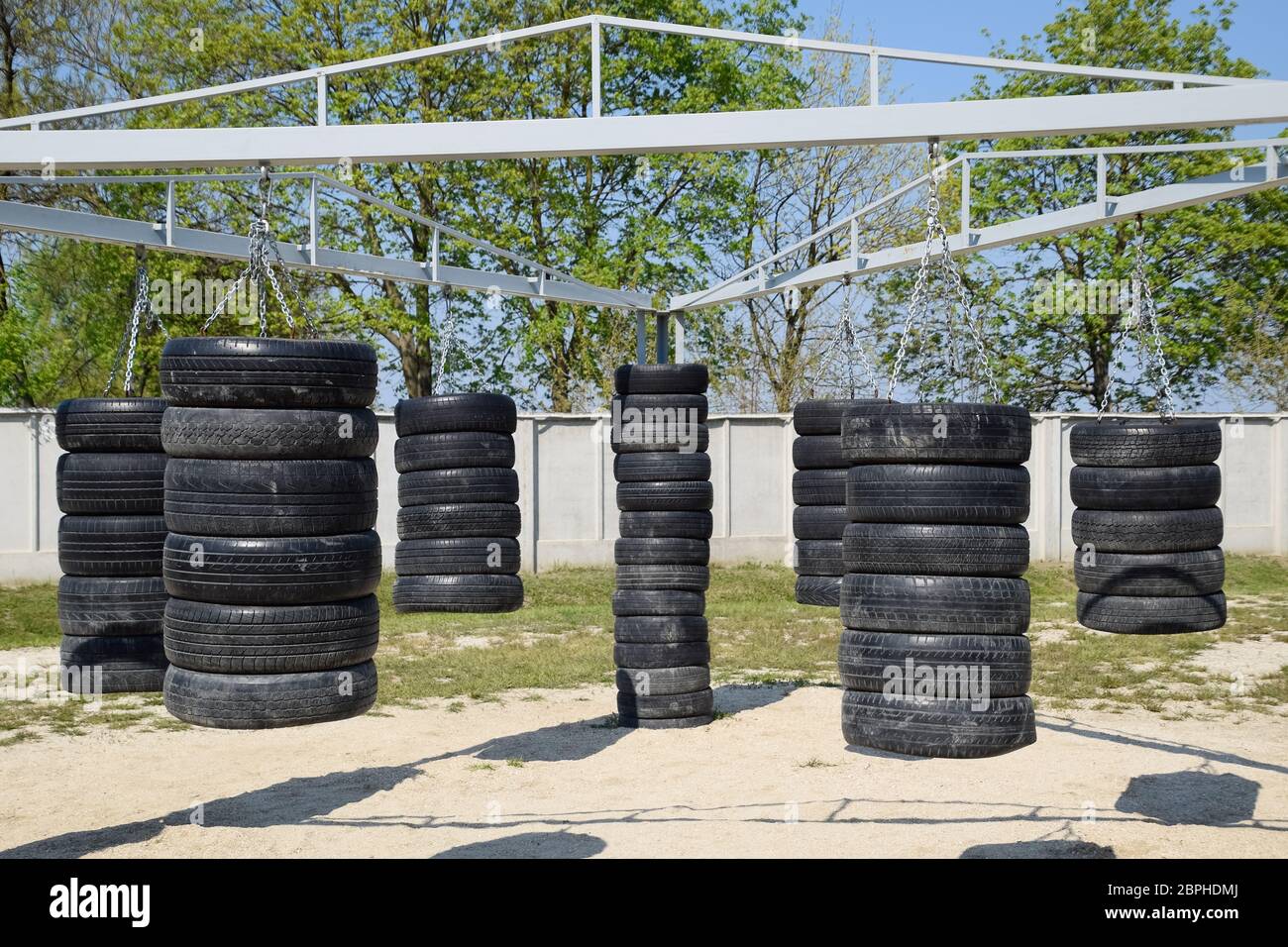 Homemade punching bags from car tires. Sports ground in the courtyard. punching  bags Stock Photo - Alamy