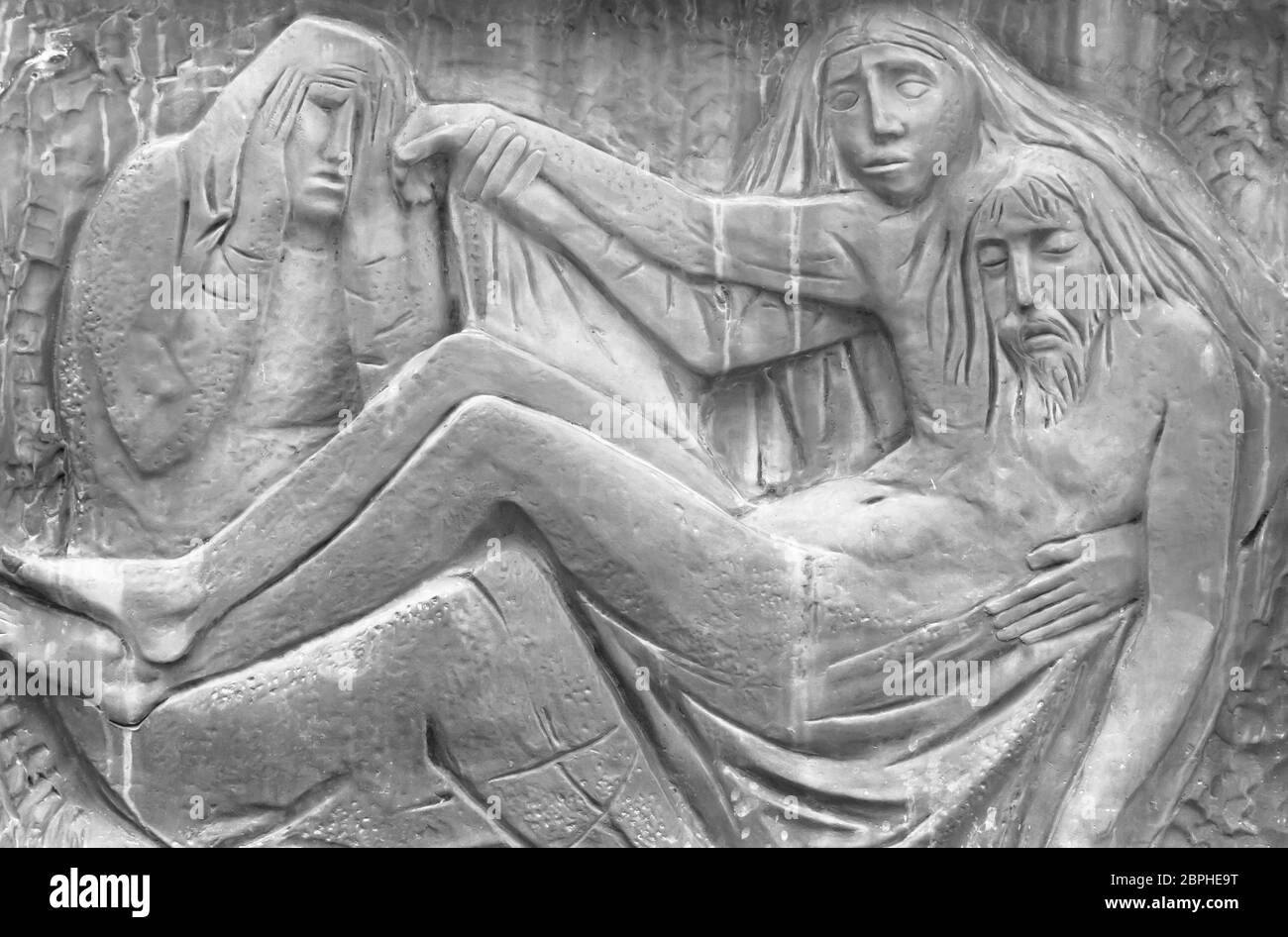 Bas-relief representing The Pity of Michelangelo. Holy Mary mother and Jesus Christ after the Crucifixion. It can be used for concepts and events. Stock Photo