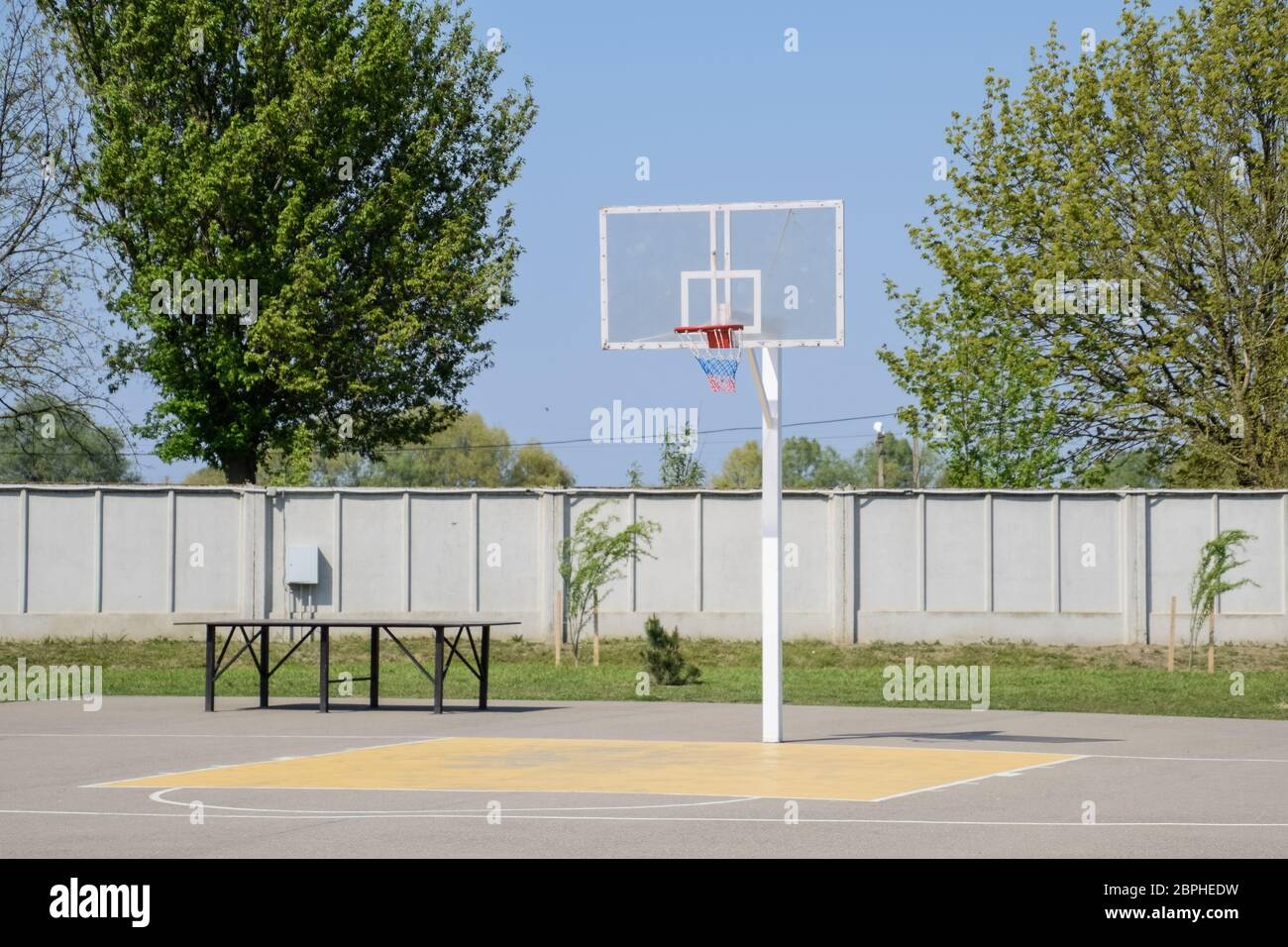 Basketball court and backboard with a hoop. Yard basketball Stock Photo
