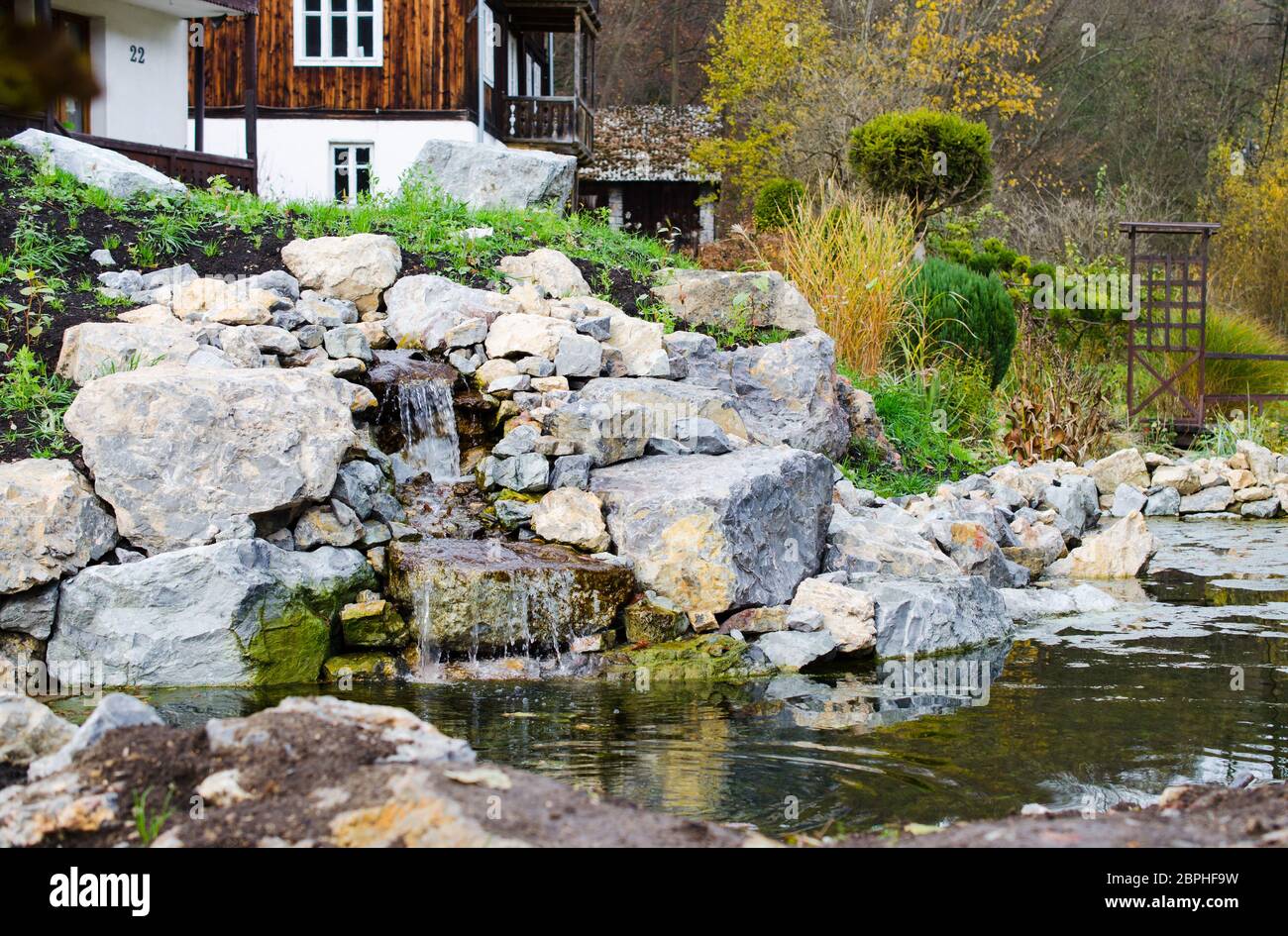 Mountain Stream In Landscape Design Near A Beautiful House Or Cottage In The Hill Autumn Time Garden In Autumn Colors In A Mountain Landscape Stock Photo Alamy