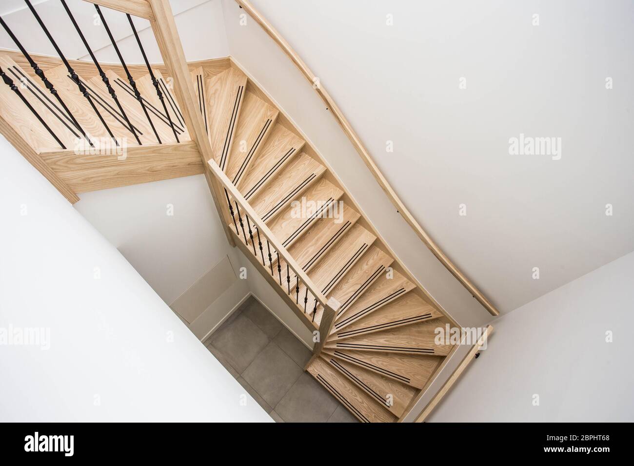 luxurious modern wooden staircase with curved landing wall modern ...