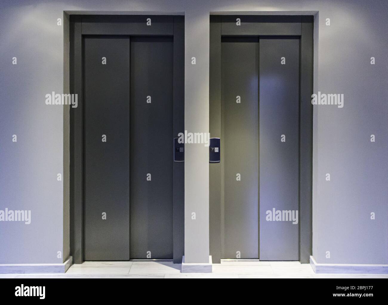 Doors of modern elevators in a building, transportation detail Stock