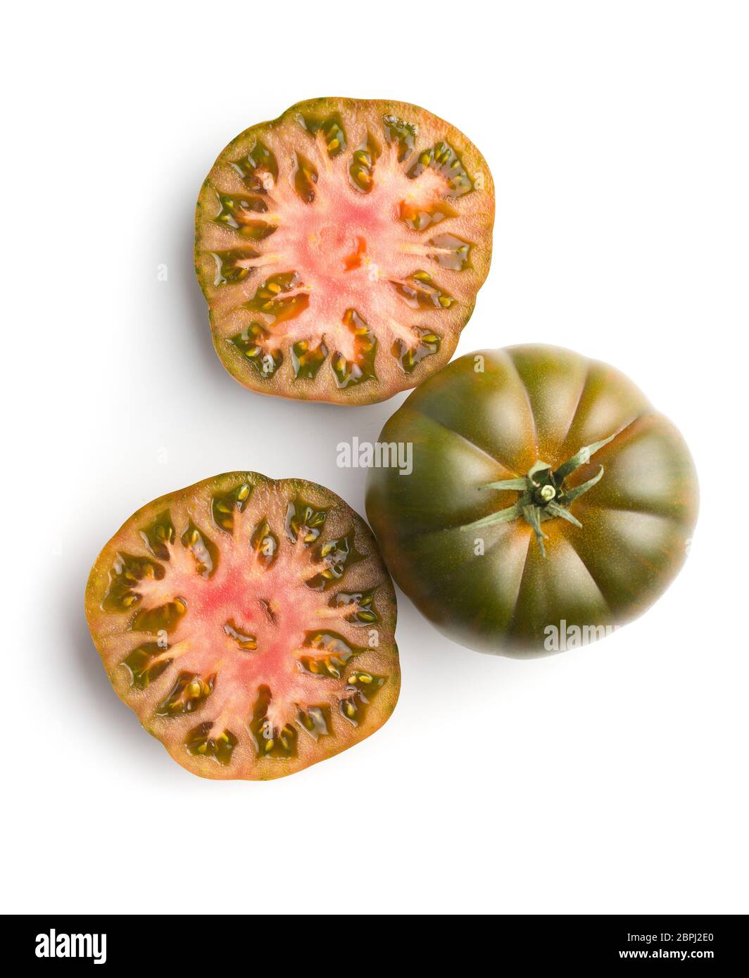 Dark brandywine tomatoes isolated on white background. Stock Photo