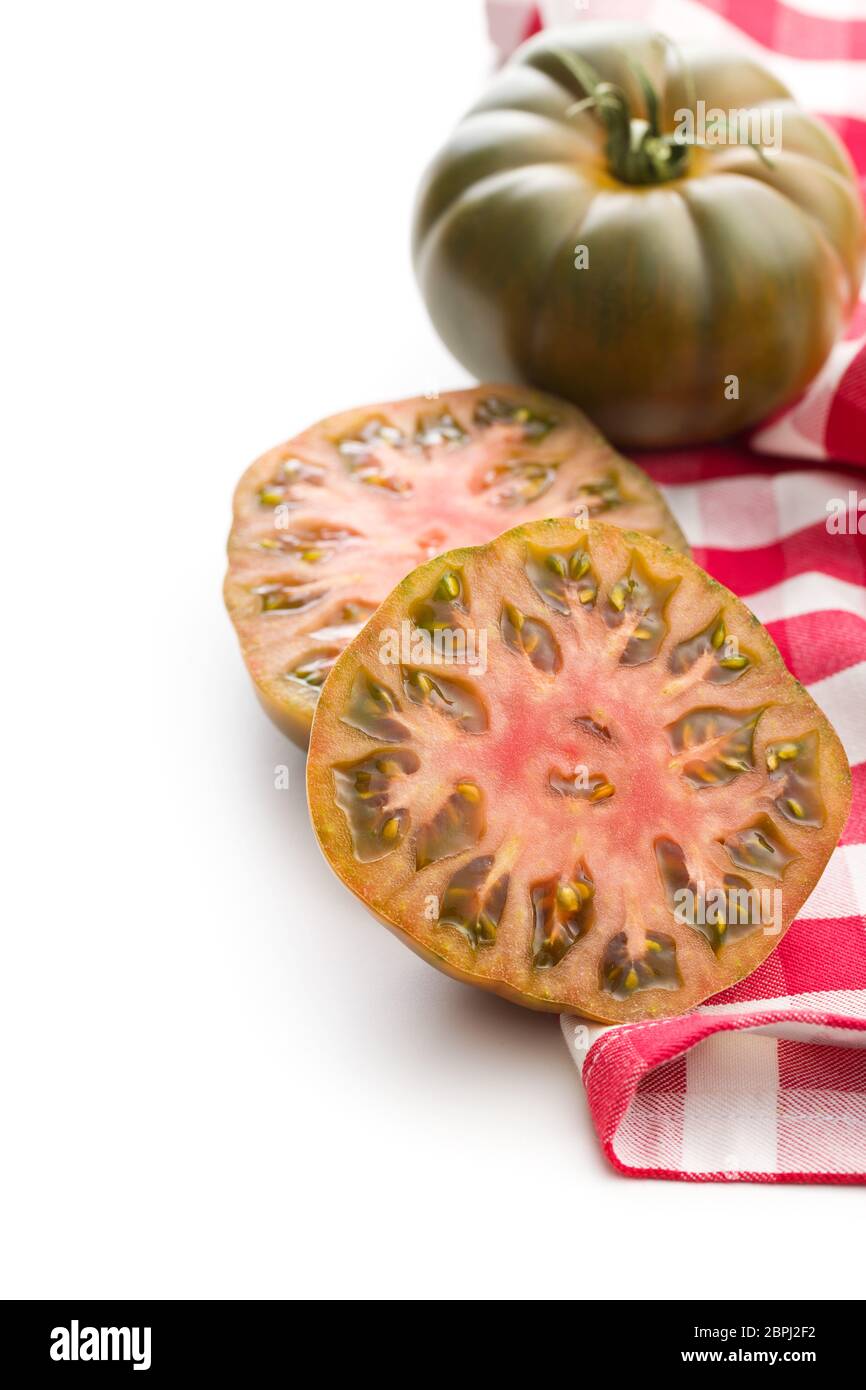 Dark brandywine tomatoes isolated on white background. Stock Photo