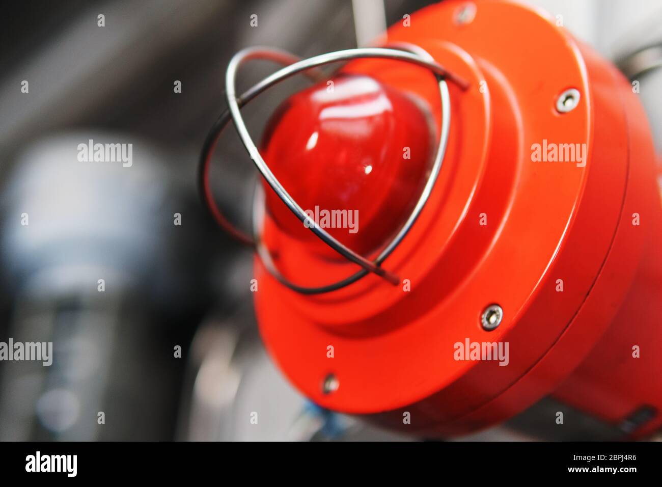 Red warning light of an emergency beacon at an industrial facility. A