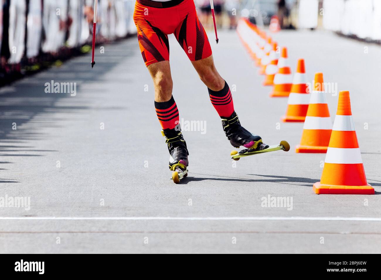 athlete skier finish in roller skiing competition Stock Photo
