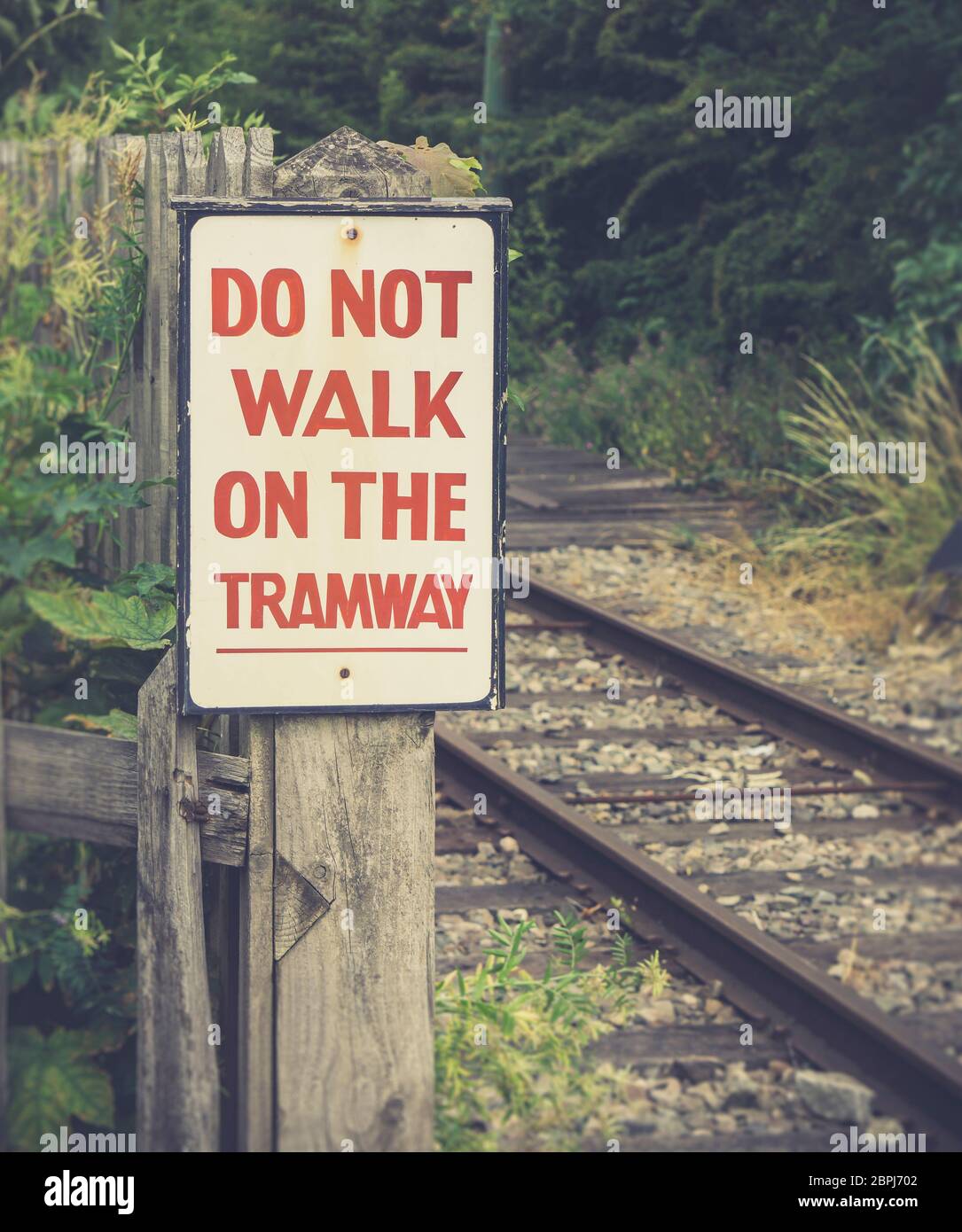 Retro close up of vintage transport sign: Do Not Walk on the Tramway, Black Country Museum, Dudley, UK. Stock Photo
