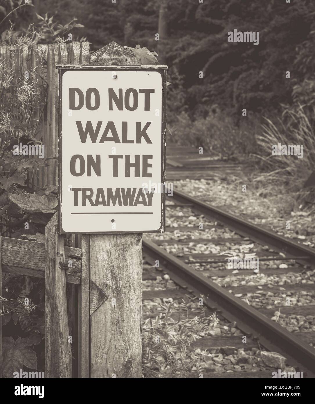 Monochrome close up of vintage transport sign: Do Not Walk on the Tramway, Black Country Museum, Dudley, UK. Stock Photo