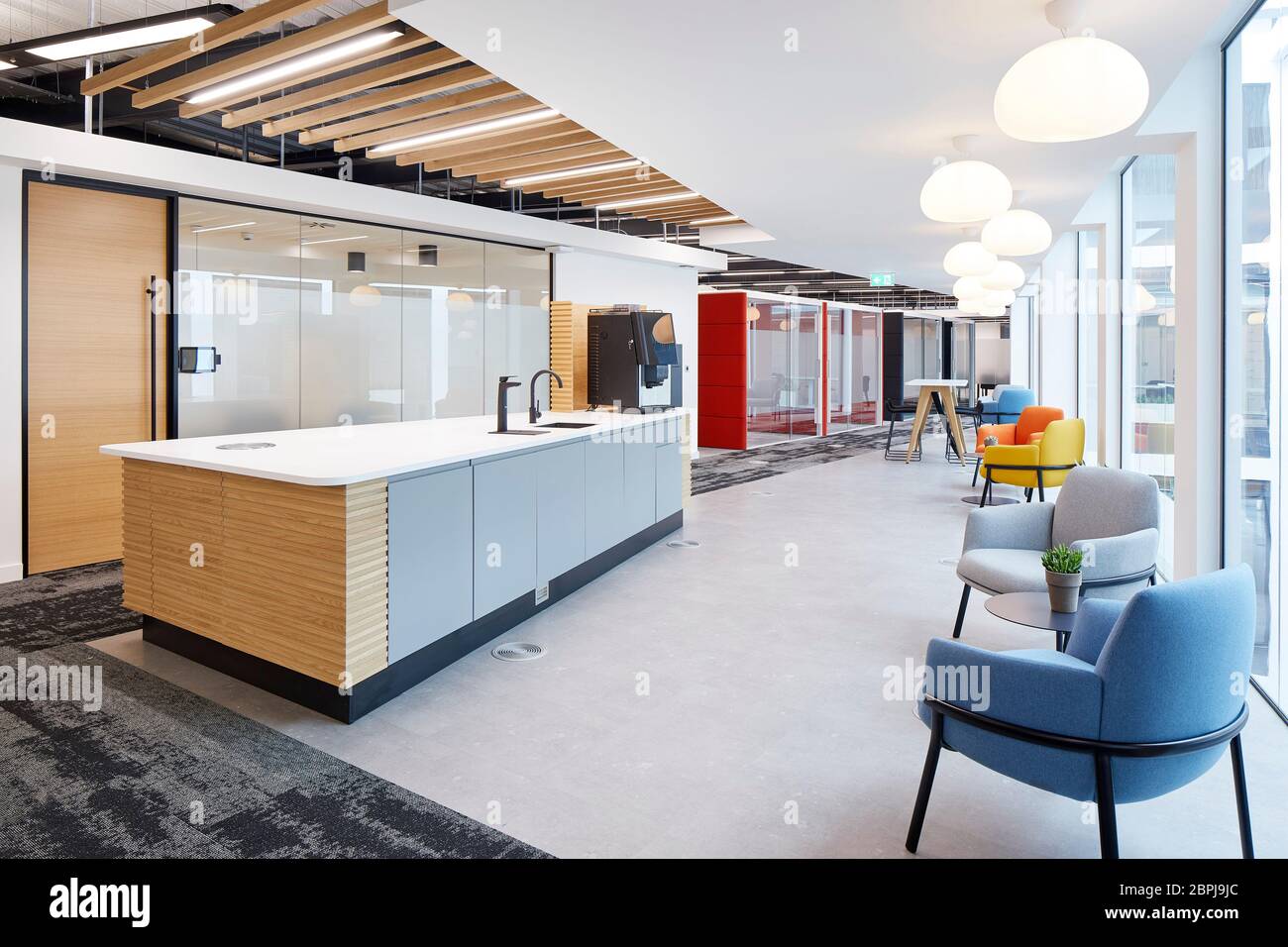 Tea point area . Contemporary UK office interior with primary colour furniture. UK Office