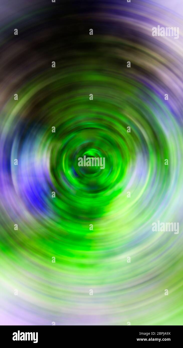 Background image with dominant glass green, and accompanied blue, purple, brown and beige colors, radial blur effect with central focal point. Digital Stock Photo
