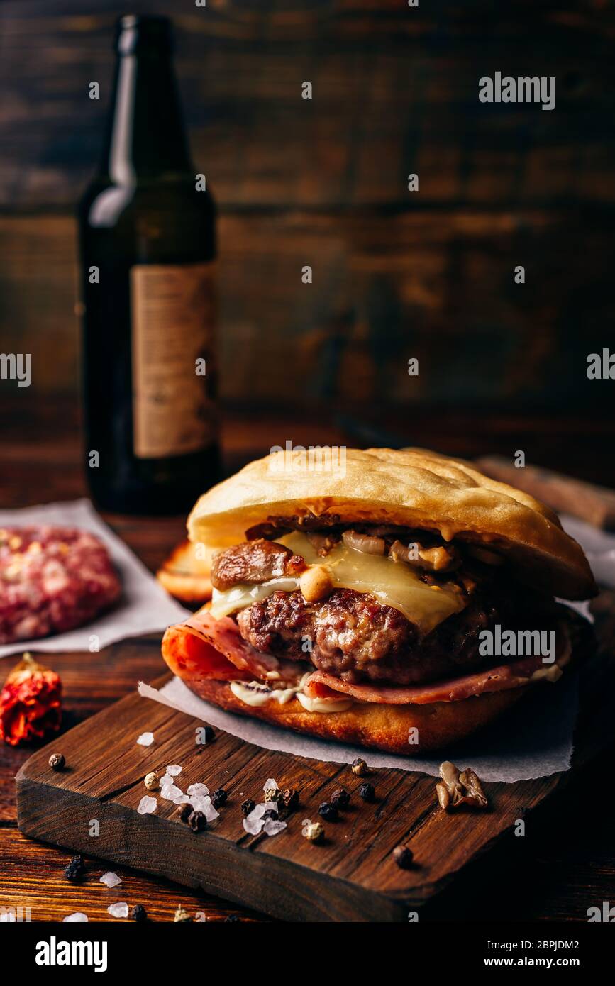 The Casanova Burger on Cutting Board with Beef Patty, Wisconsin Swiss