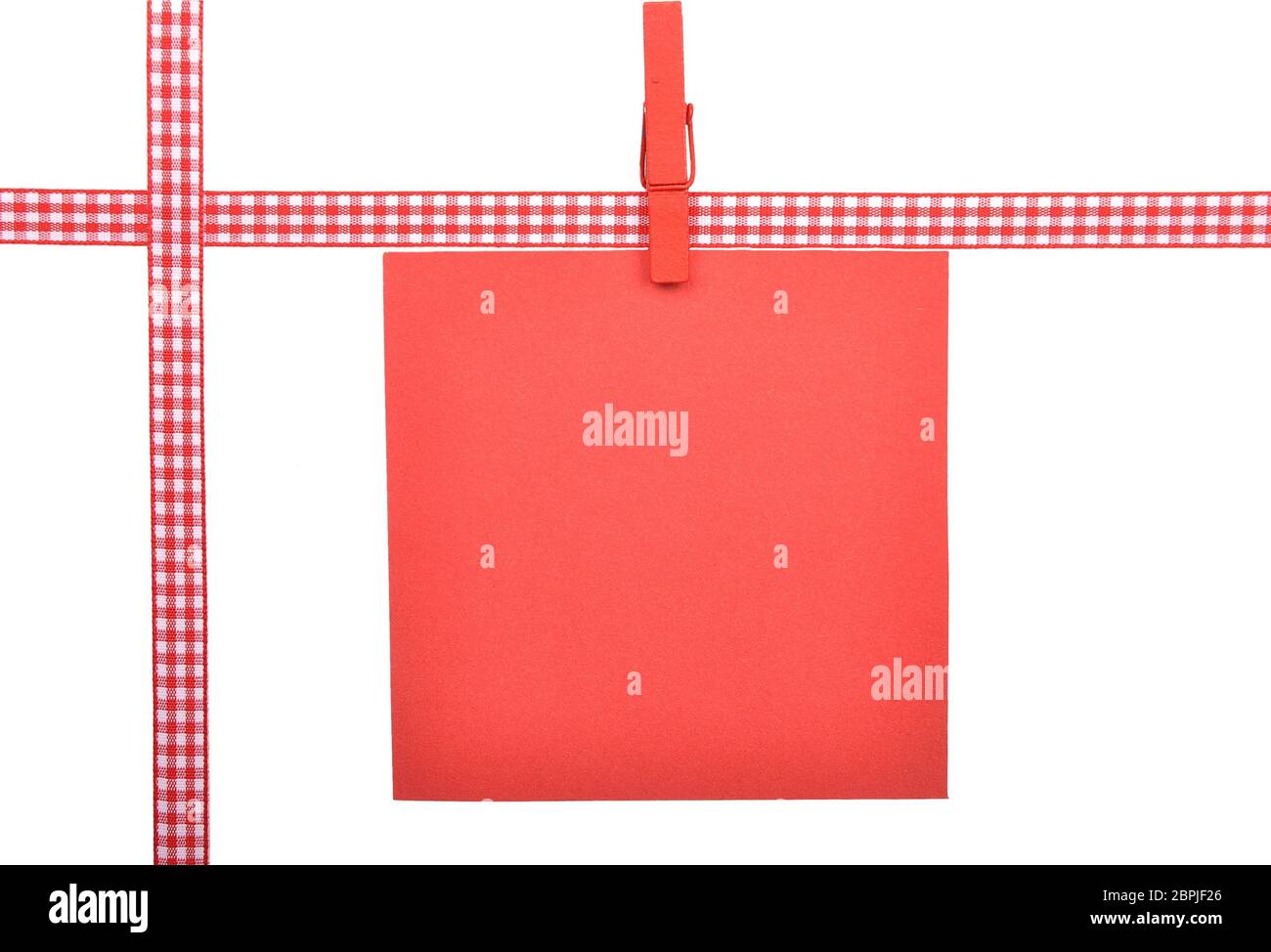 Checked ribbon and paper on white background Stock Photo