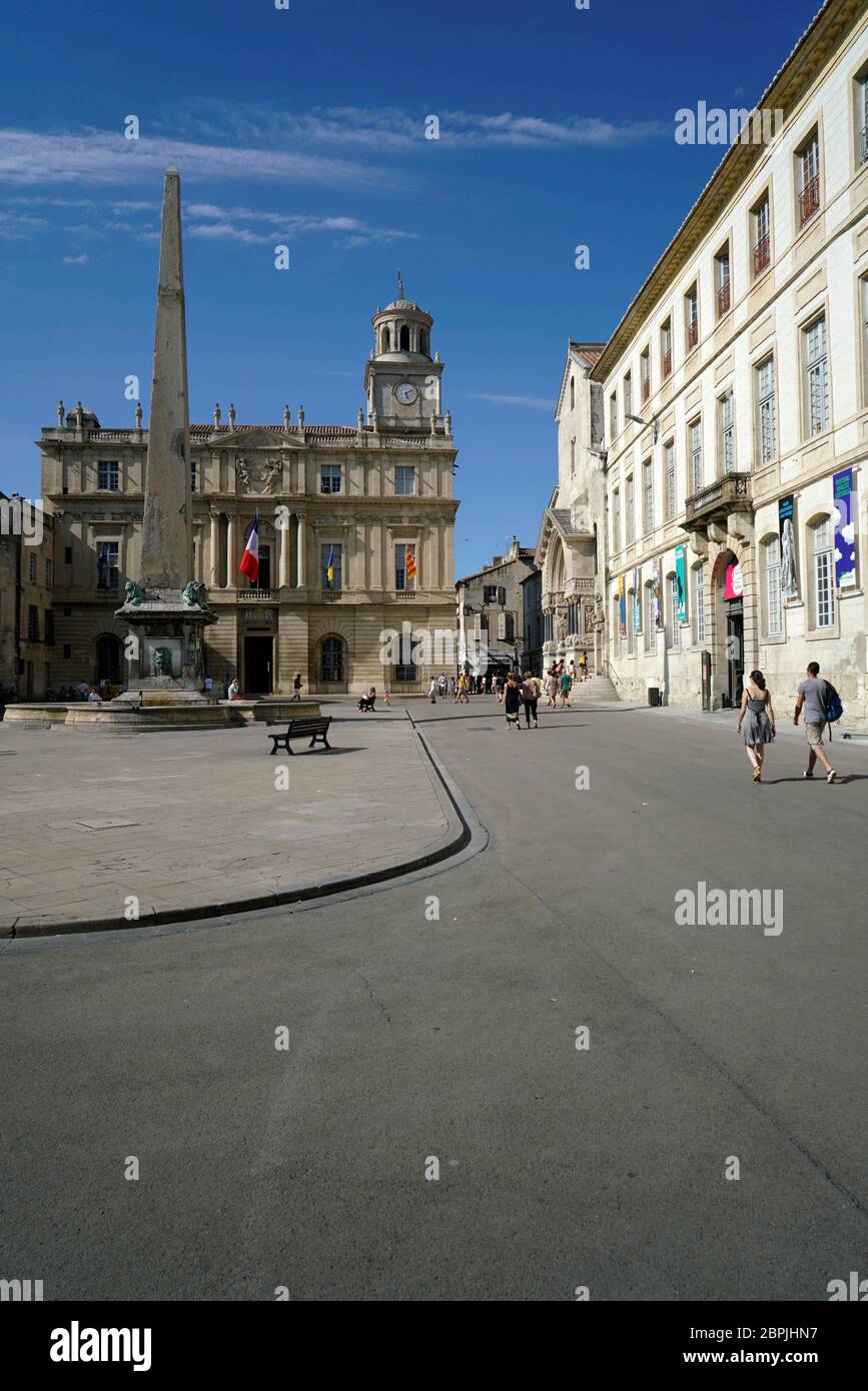 Place de la Republique with Arles Obelisk and Hotel de Ville city hall in the background.Bouches-du-Rhone.France Stock Photo
