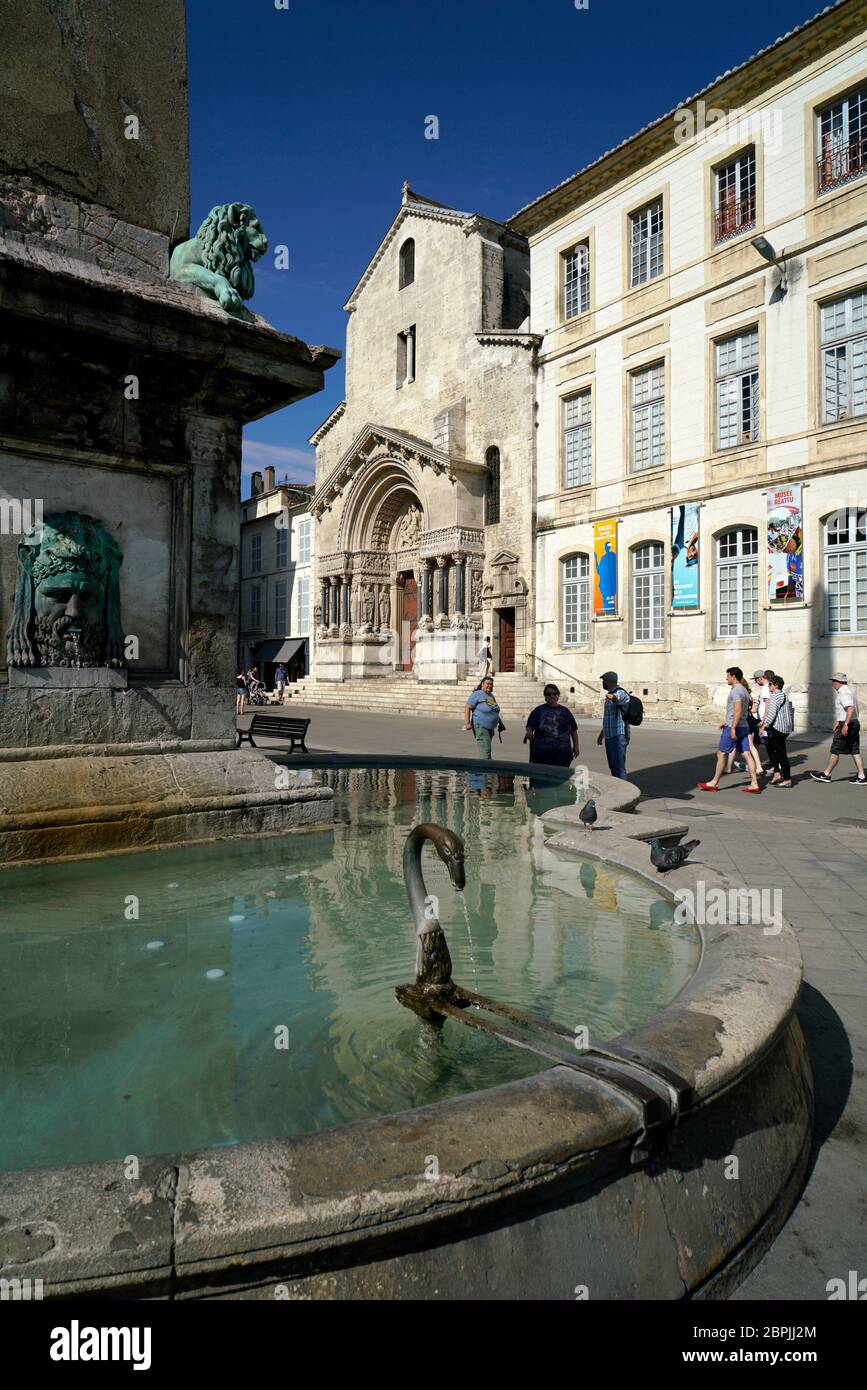 The fountain of 4th century Arles Obelisk in Place de la Republique with the Cathedral of St.Trophime in the background.Arles.Provence-Alpes-Cote d'Azur.France Stock Photo