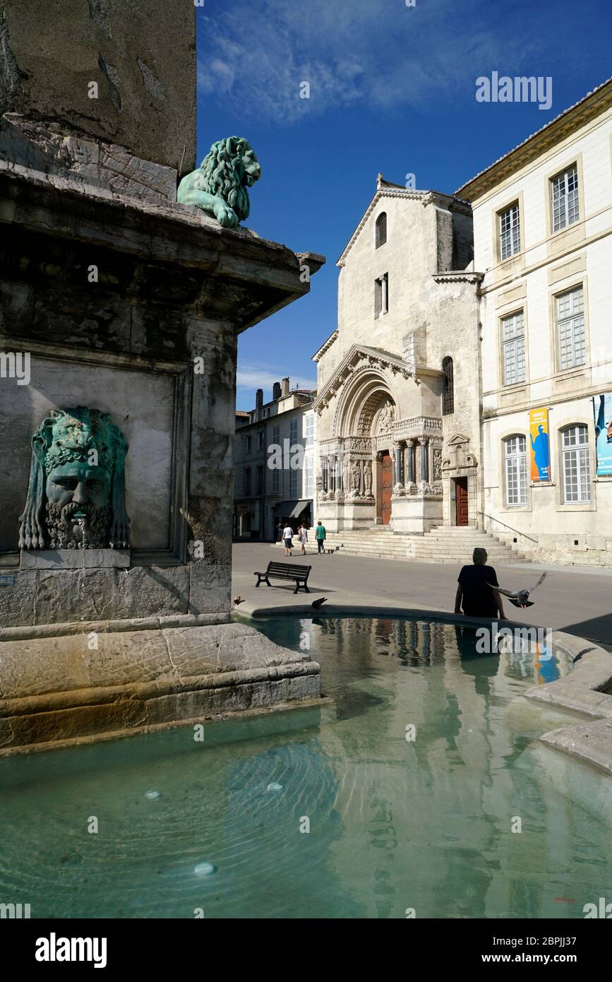 The fountain of 4th century Arles Obelisk in Place de la Republique with the Cathedral of St.Trophime in the background.Arles.Provence-Alpes-Cote d'Azur.France Stock Photo