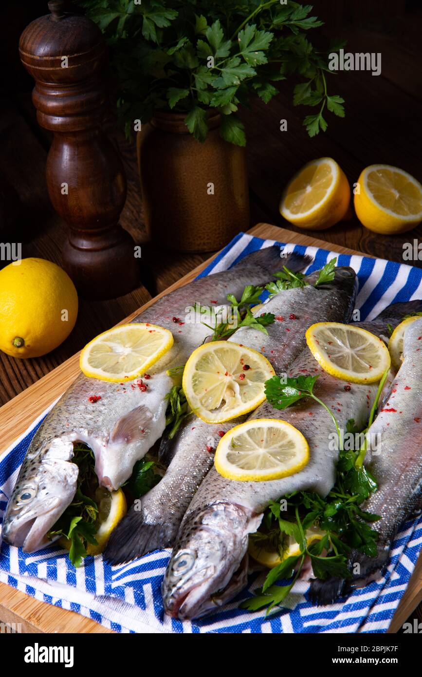 fresh trout with lemon and different herbs Stock Photo Alamy