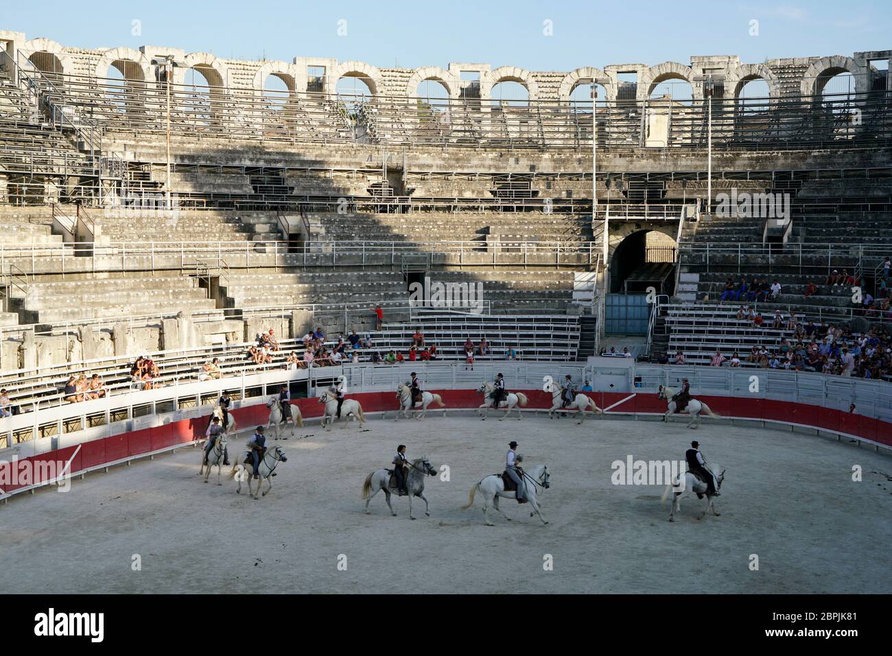 The Camargue cowboys aka Gardians showing their skill of horse riding and cattle herding in ancient Roman Amphitheater. Arles.Bouches-du-Rhone.Alpes-Cote d'Azur.France Stock Photo