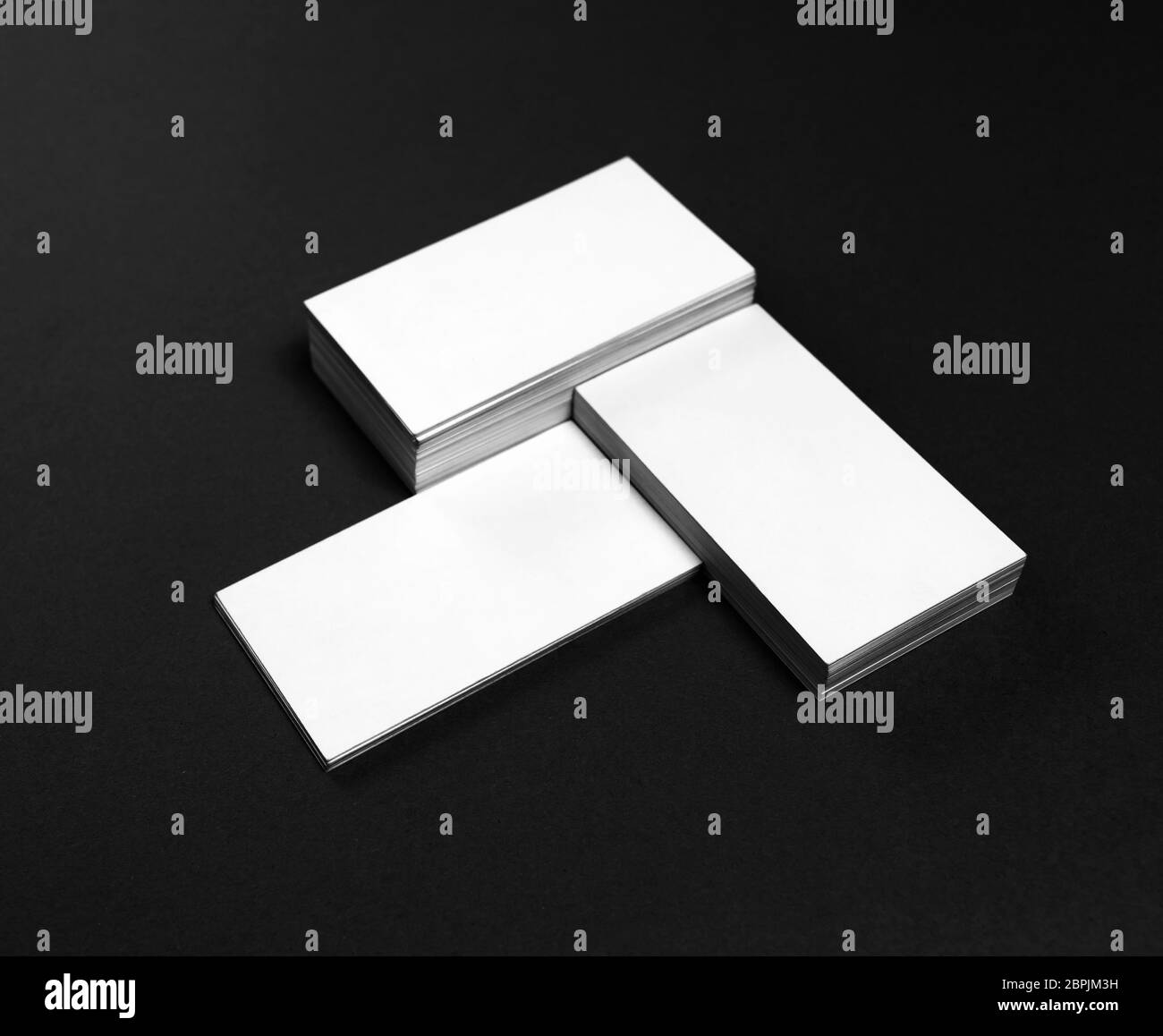 Blank business cards on black paper background. Template for ID