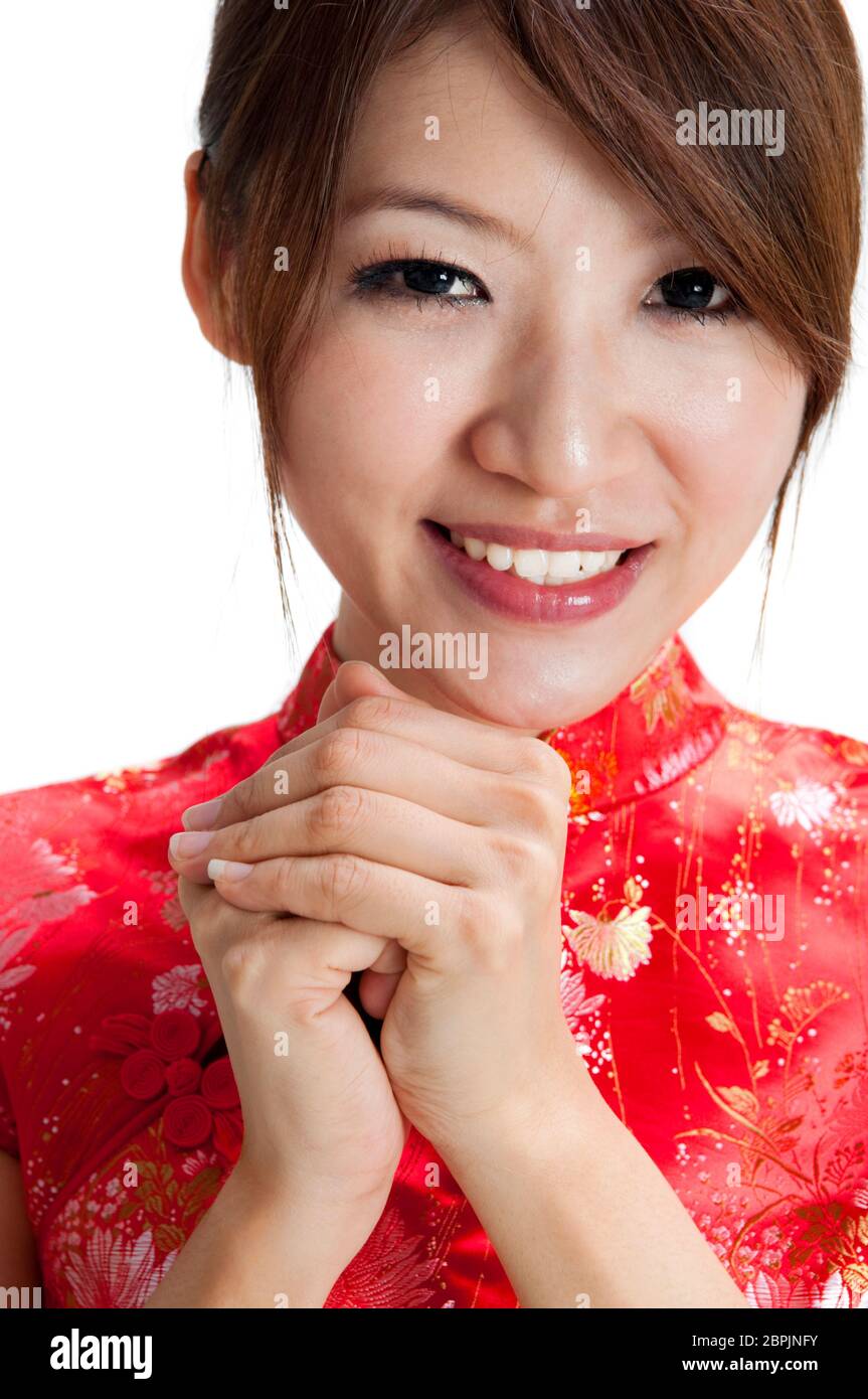 Oriental girl giving greeting for Chinese new year Stock Photo - Alamy
