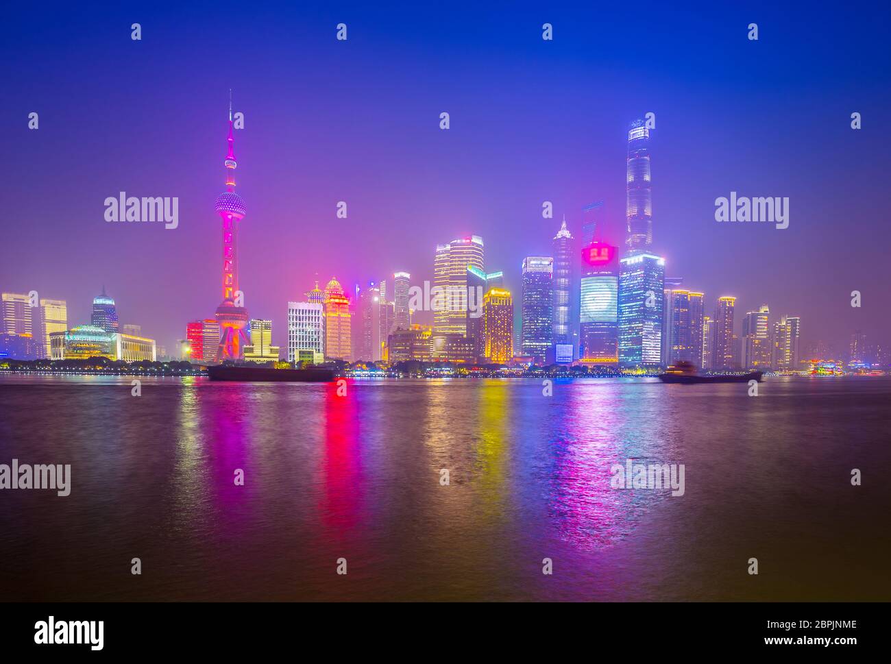 Shanghai by the Huangpu River on a foggy night, China city skyline Stock Photo
