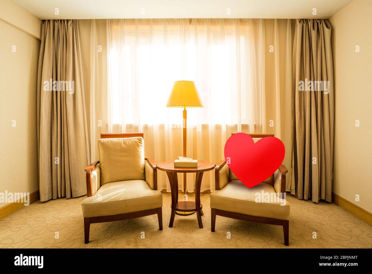 red heart sit on wooden chair, loneliness and waiting for someone or love concept Stock Photo
