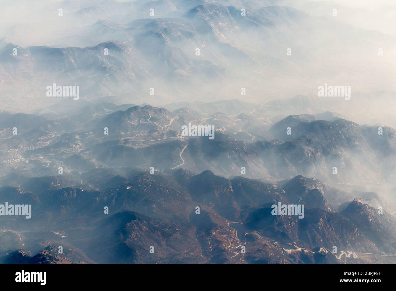 Aerial landscape mountain lost in thick fog in China, bird eye view landscape look like a painting style of chinese Stock Photo