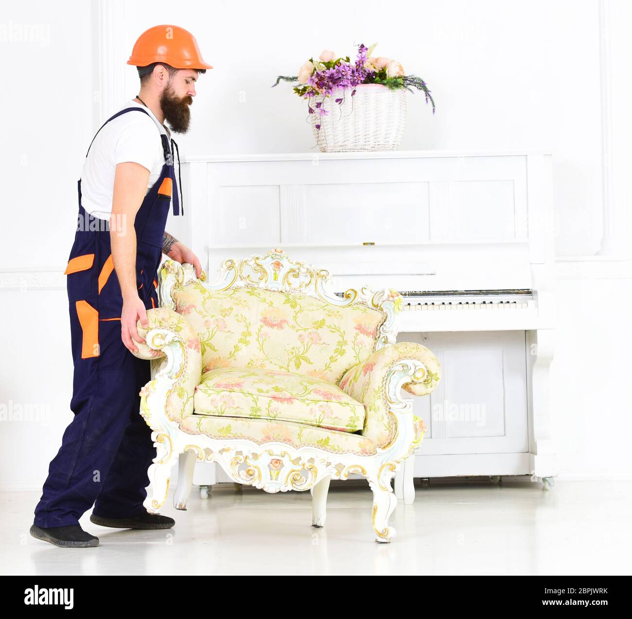 Courier delivers furniture in case of move out, relocation. Man with