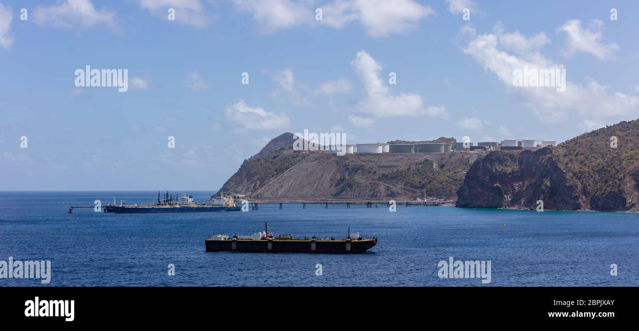 St. Eustatius island. Panorama of huge fuel tanks up on the hills and