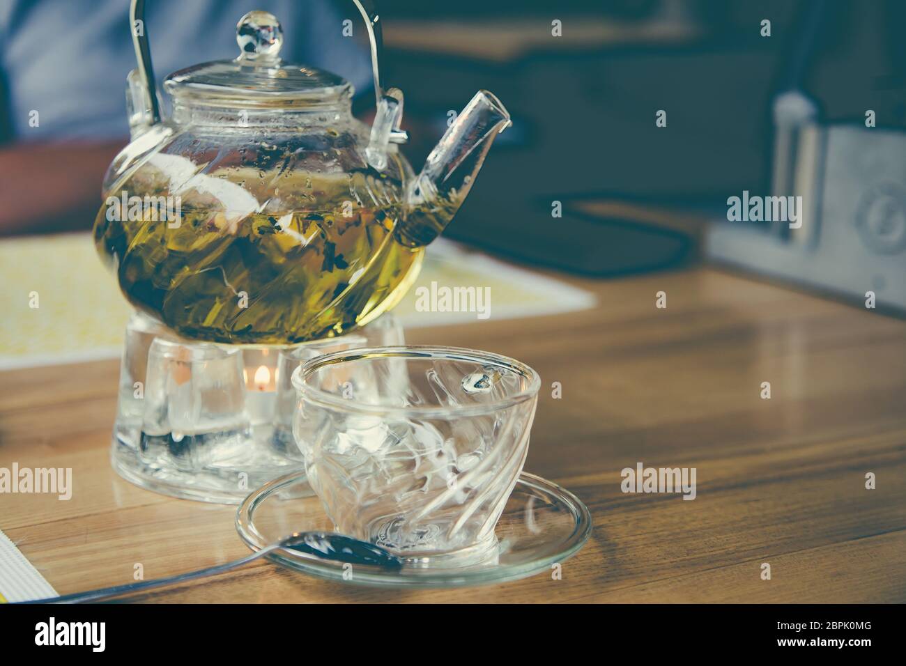glass teapot and glass cup with herbal tea Stock Photo - Alamy