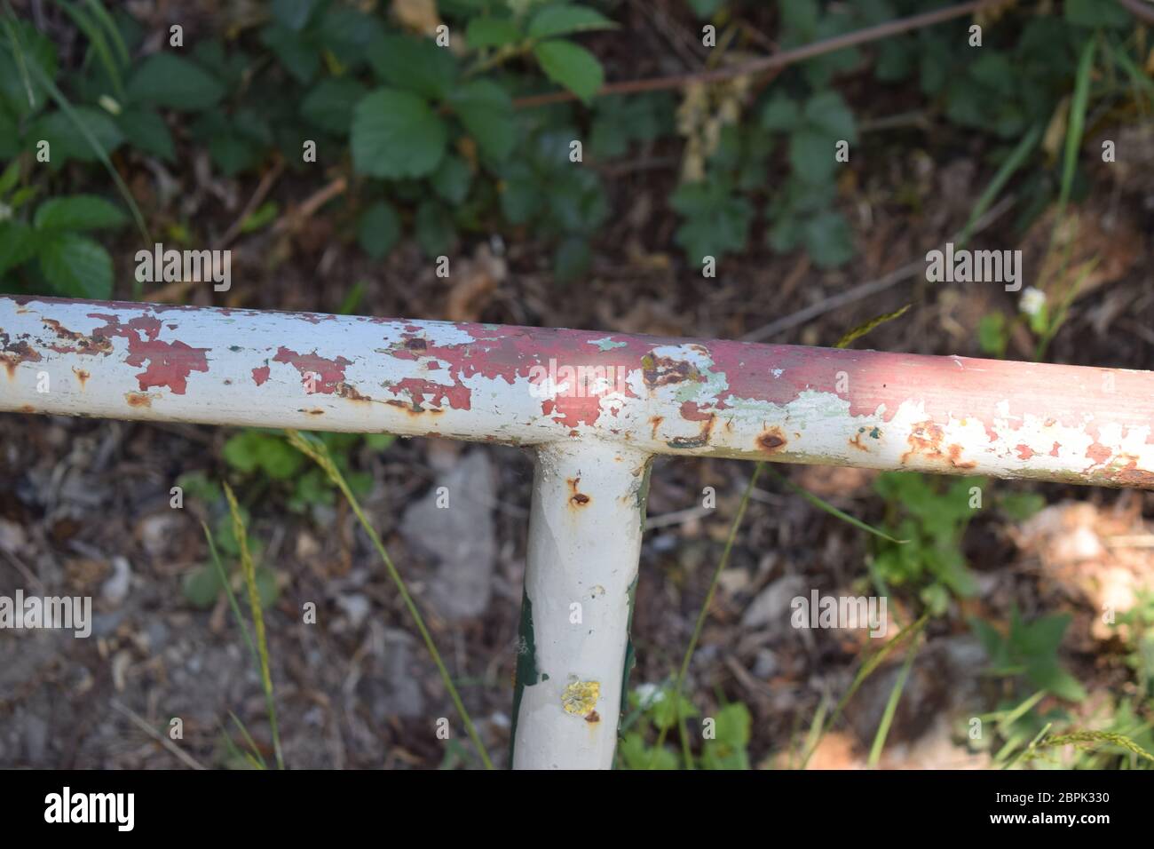 rusty old handle on a station stairway Stock Photo