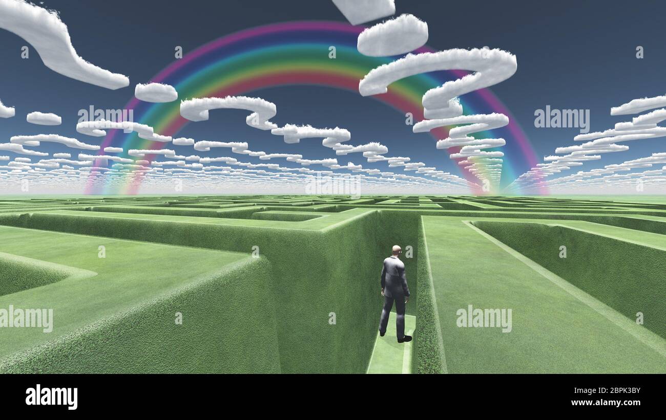 Man in maze with question mark shaped clouds Stock Photo