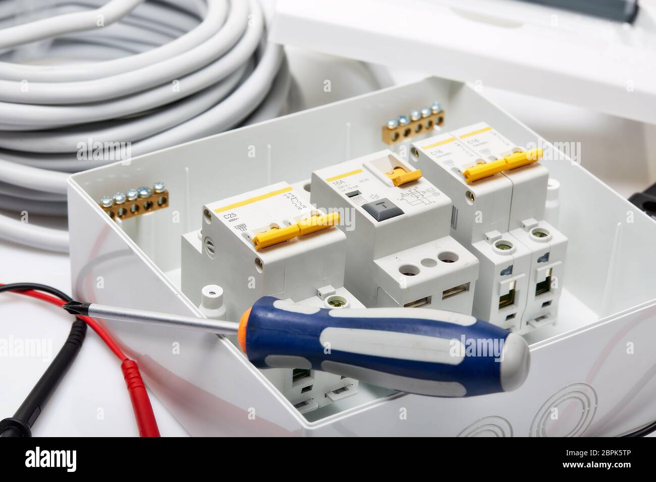 Automatic circuit breakers, distribution box, cable and screwdriver on