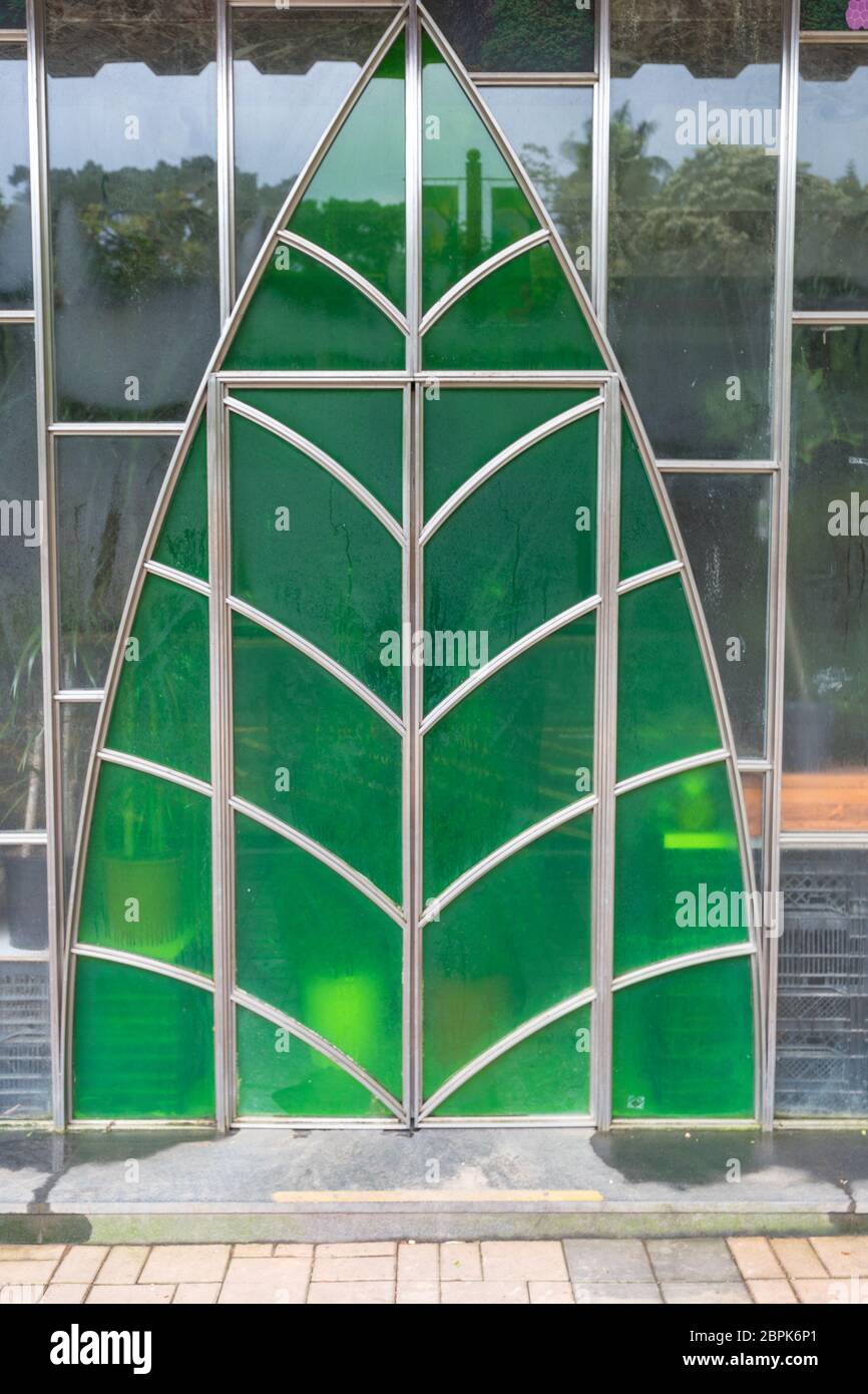 Green Glass Door at Greenhouse Plants Nursery Stock Photo